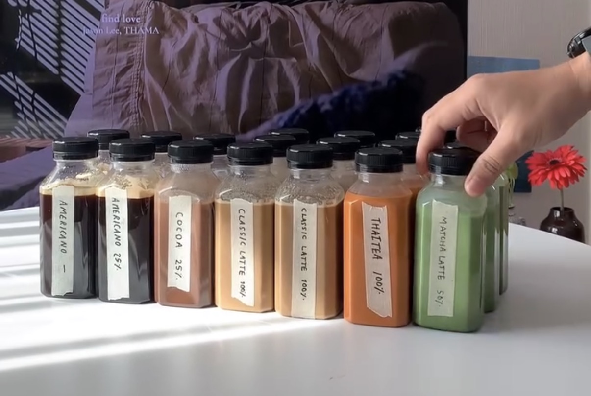 Bottled Madbear americano, cocoa, latte, Thai tea and matcha in a row